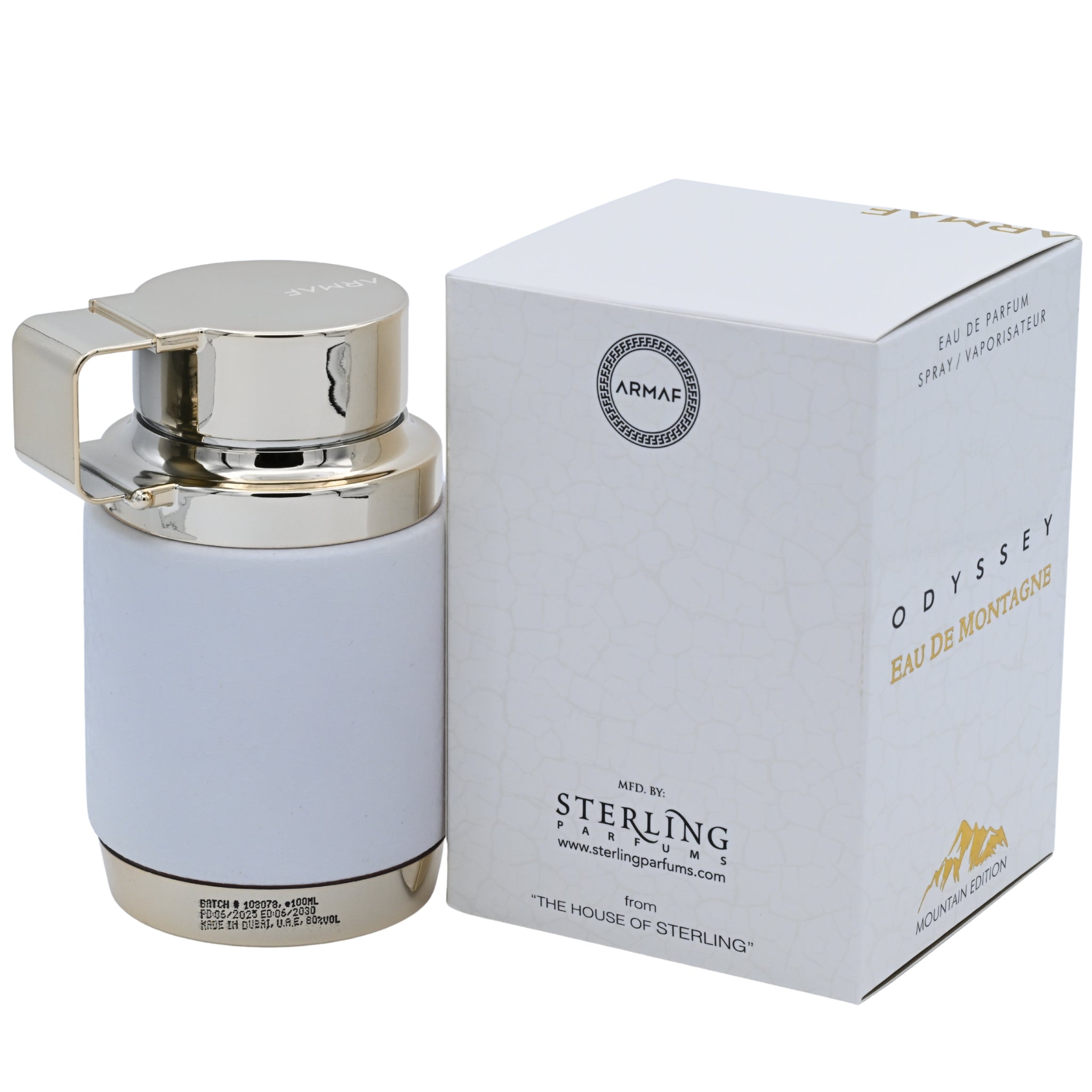 Perfume bottle with silver cap and light blue body next to its packaging on a white background