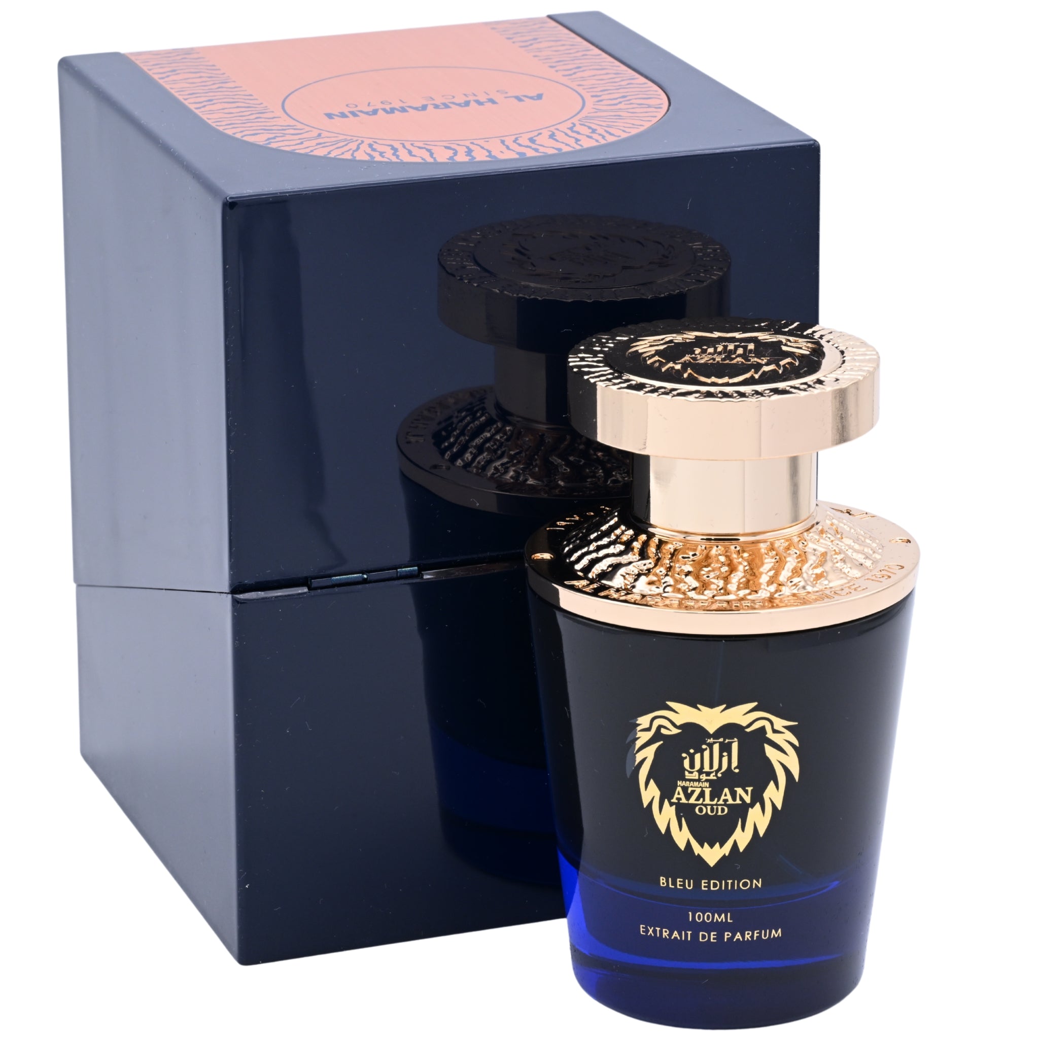 Perfume bottle with gold cap and blue packaging next to its box on a white background