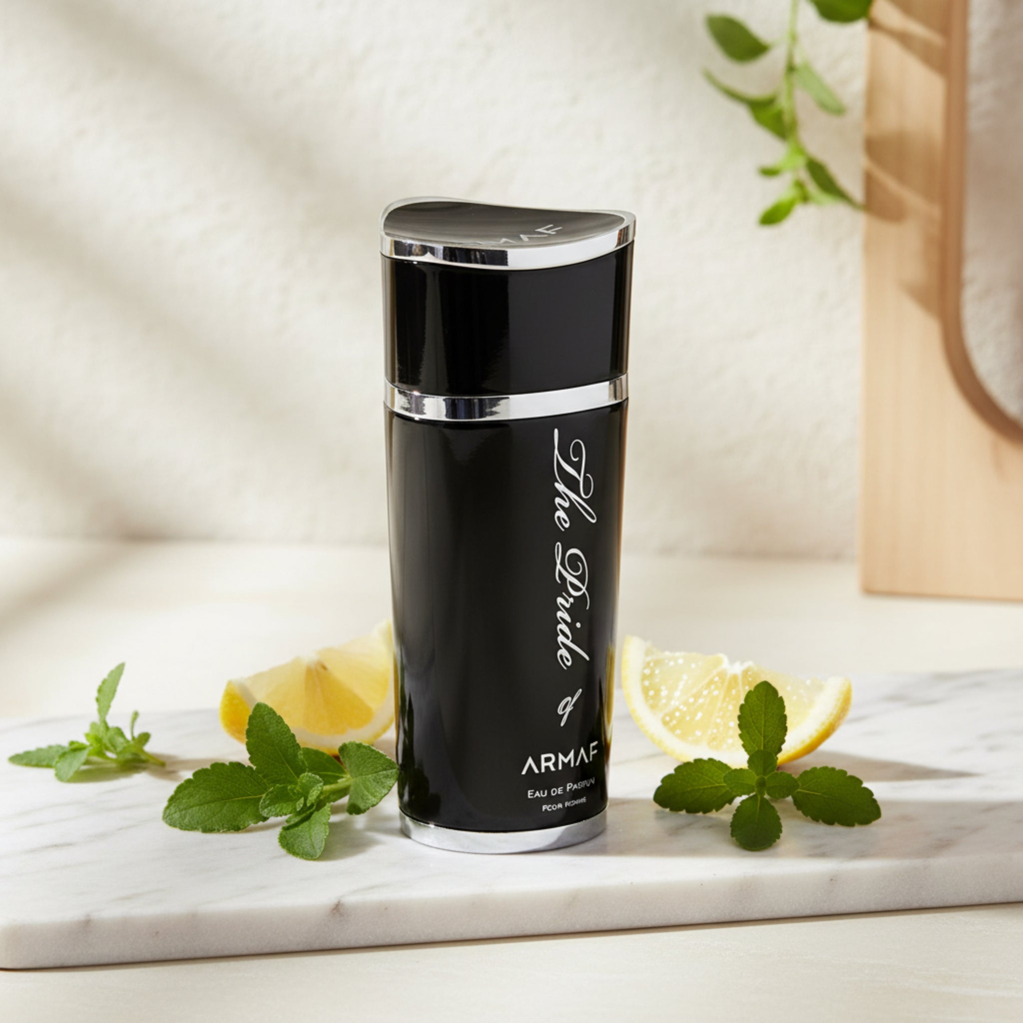 Black Armaf perfume bottle with silver accents on a white background
