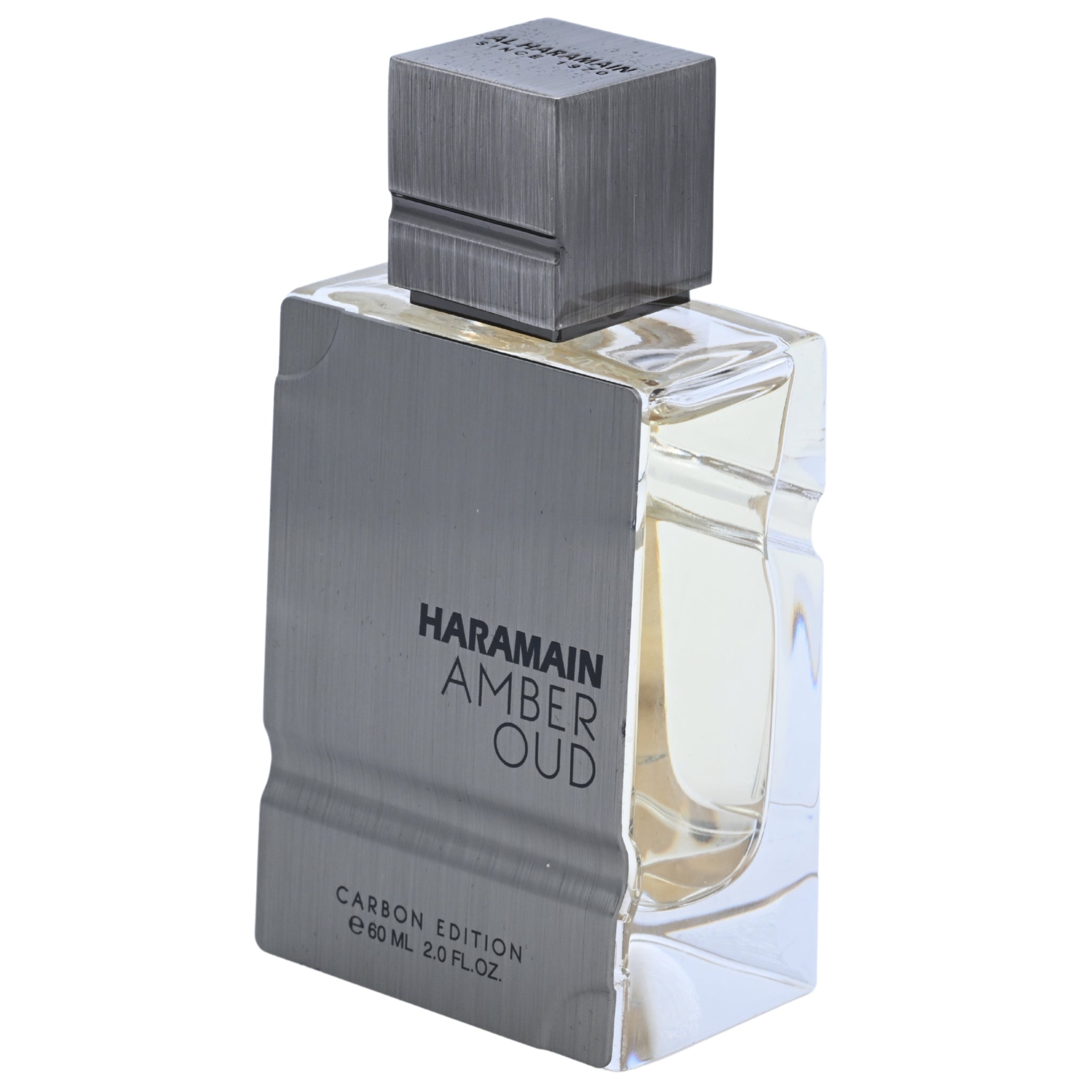 Haramain Amber Oud perfume bottle with silver cap and base on a white background