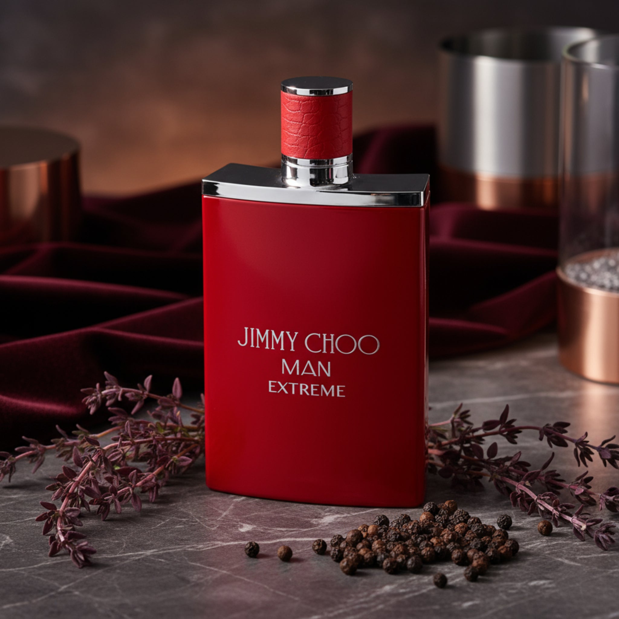 Red perfume bottle with silver cap labeled 'Jimmy Choo Man Extreme' on a white background