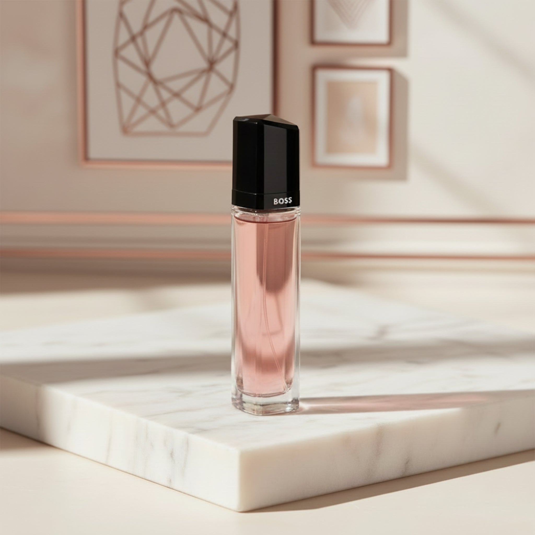 Pink perfume bottle with black cap on a white background