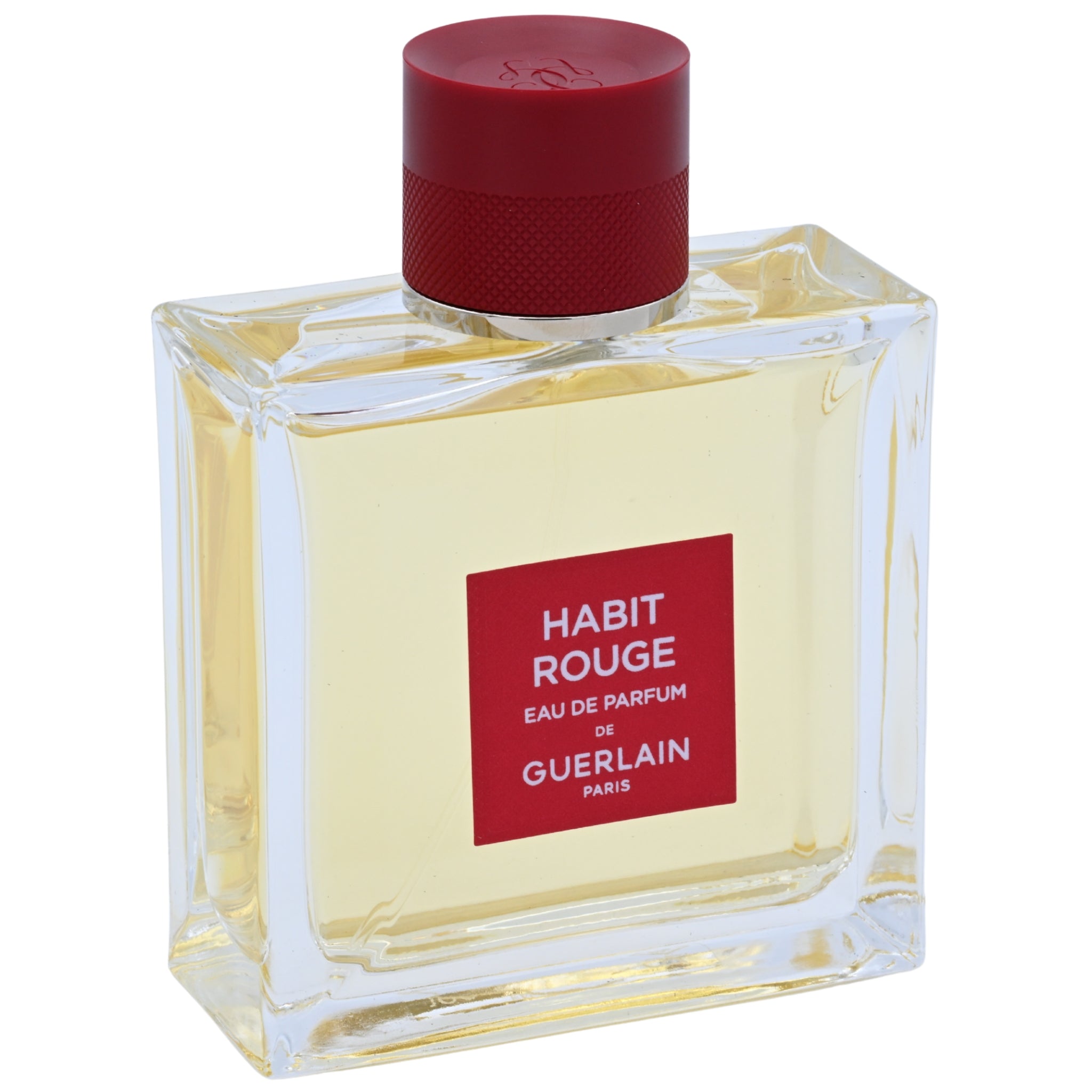 Perfume bottle labeled 'Habit Rouge' by Guerlain on a white background