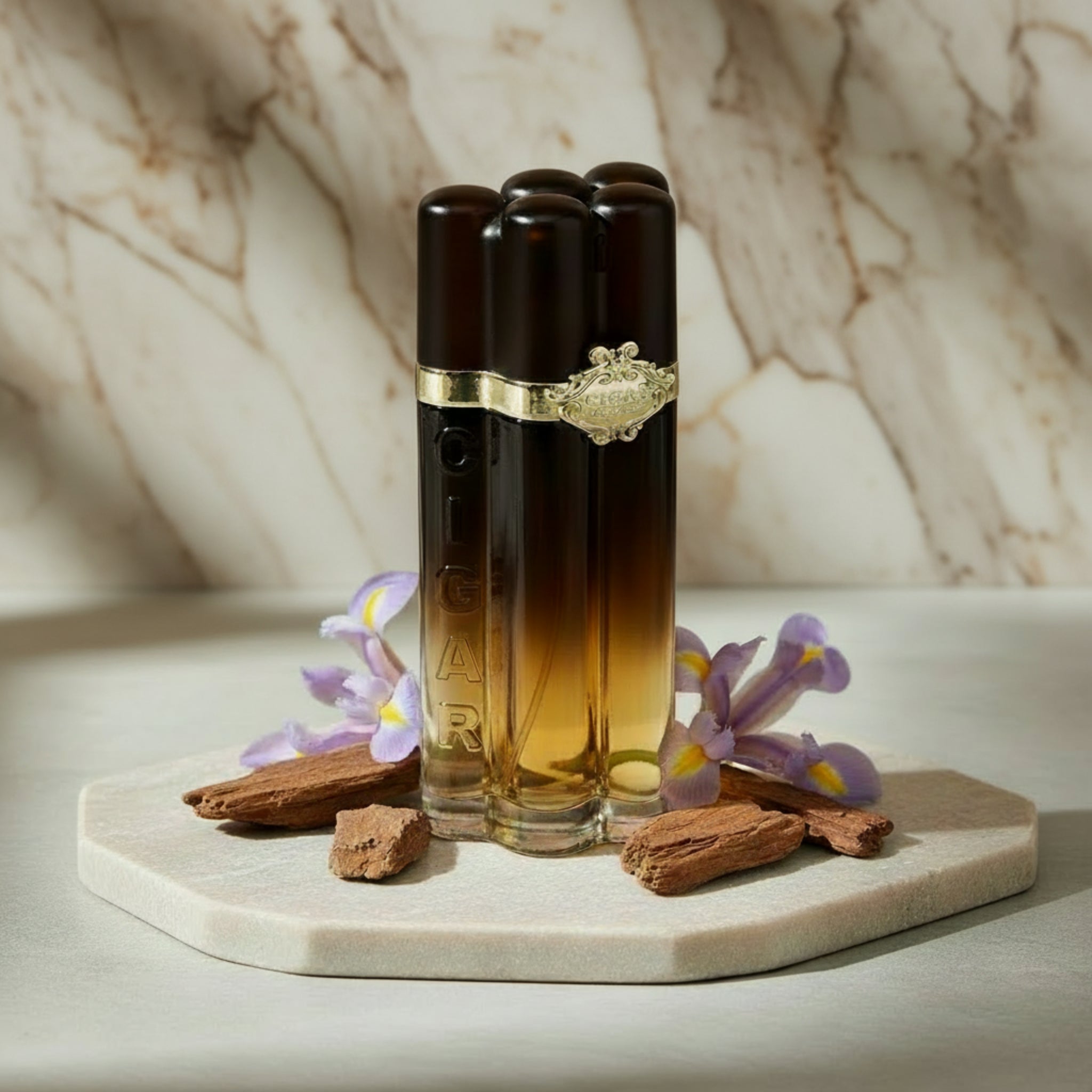 Cigar-shaped perfume bottle with gold accents on a white background