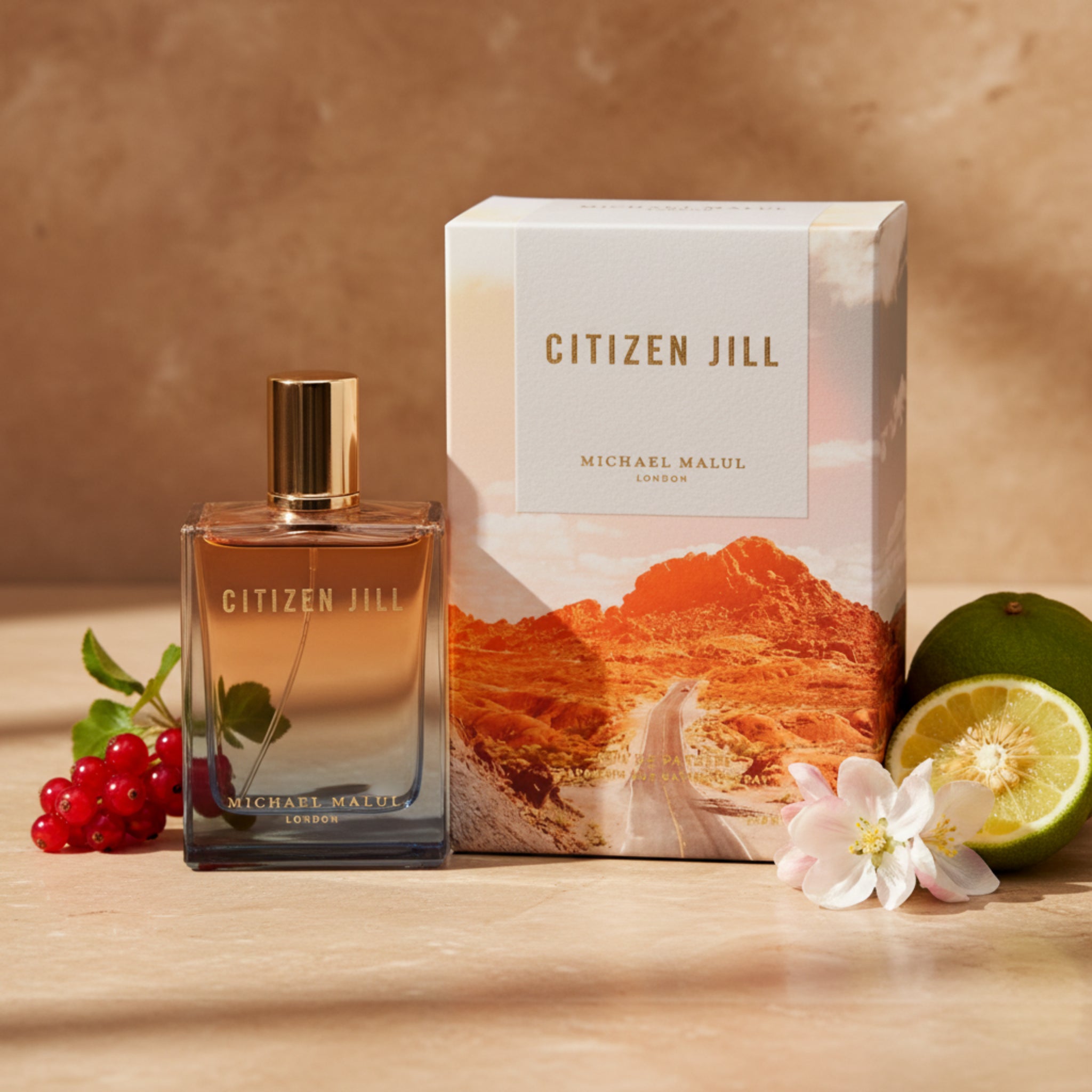 Perfume bottle and packaging with desert landscape design, featuring the brand 'Citizen Jill'.