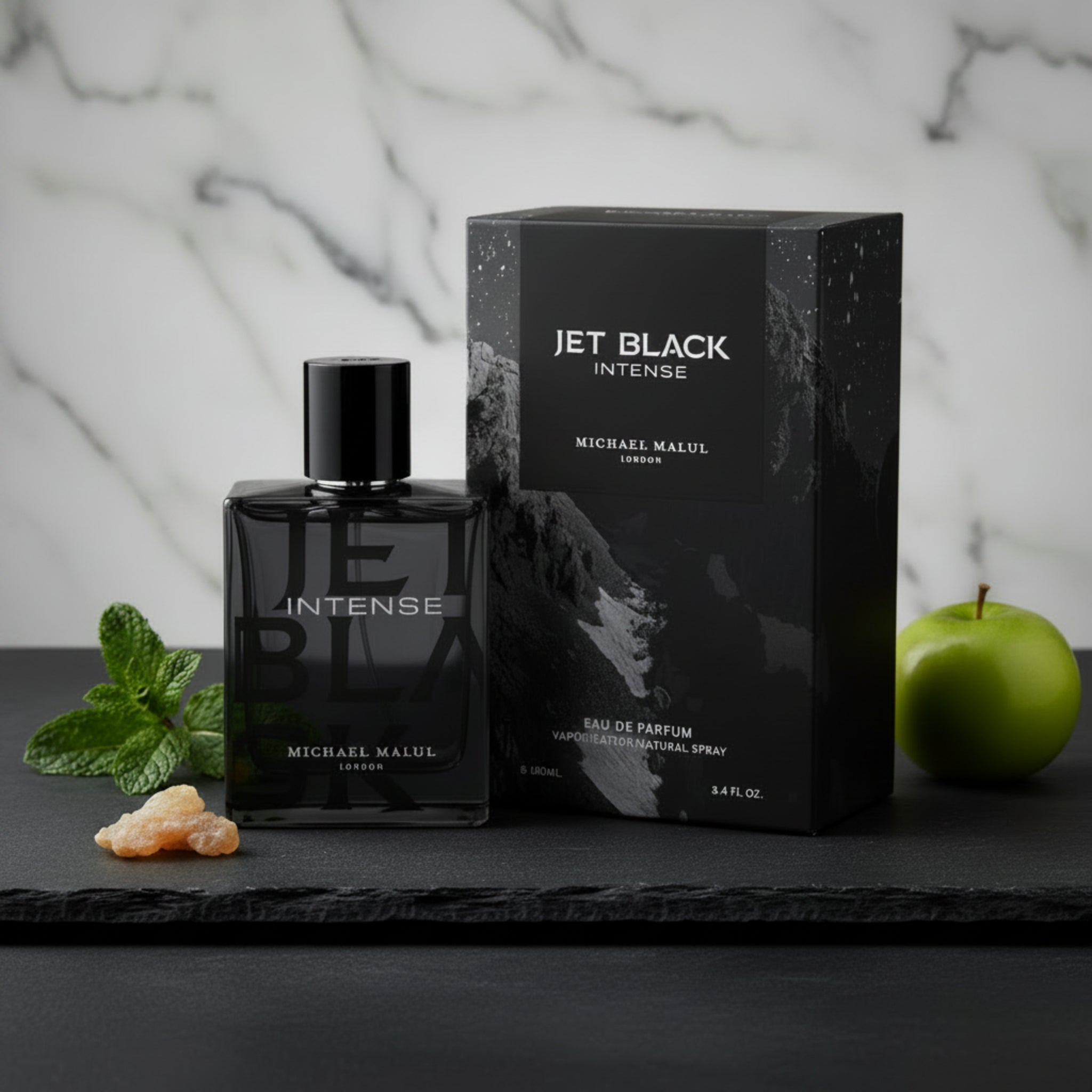 Black perfume bottle and packaging of 'Jet Black Intense' by Michael Malul on a white background