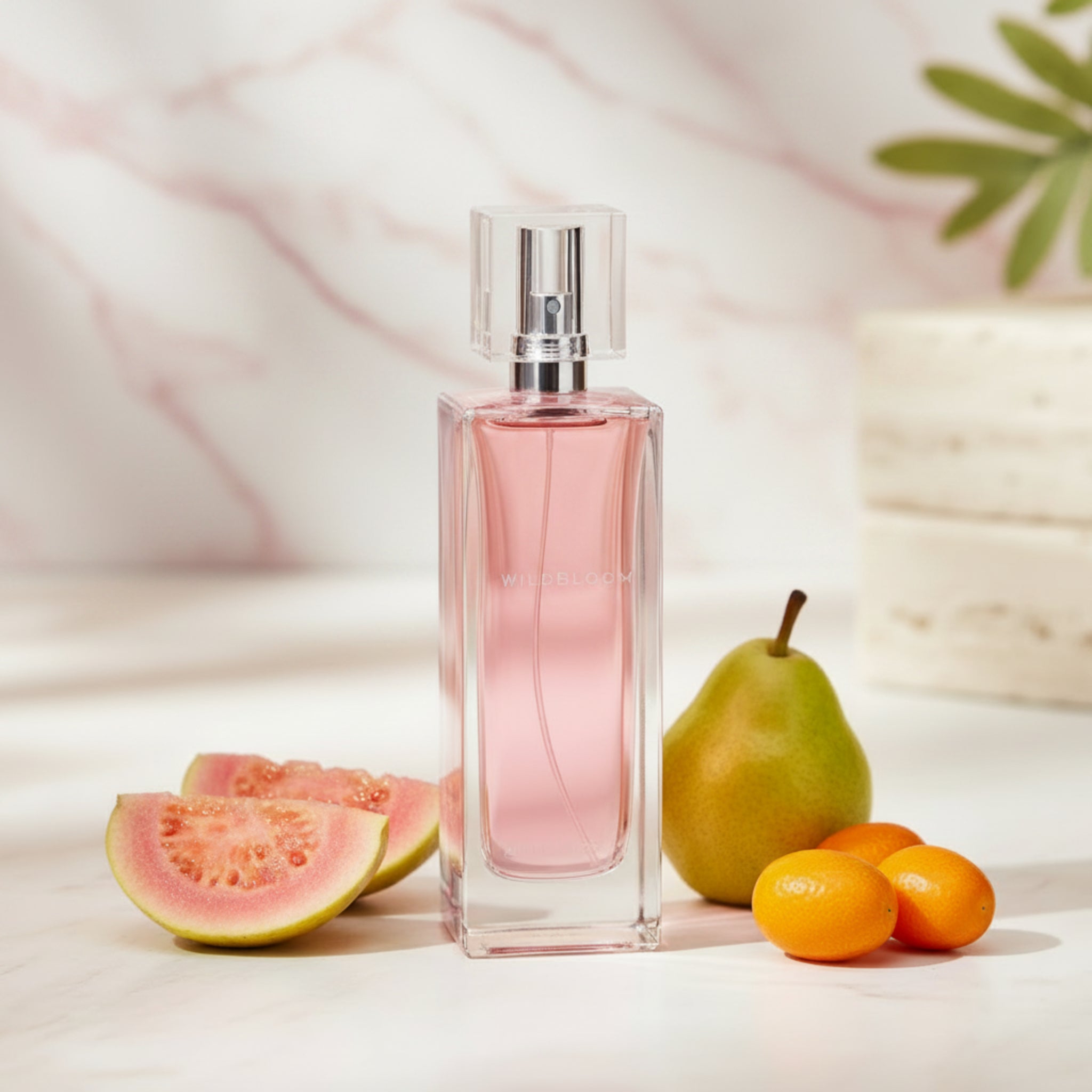 Pink perfume bottle with a clear cap on a white background