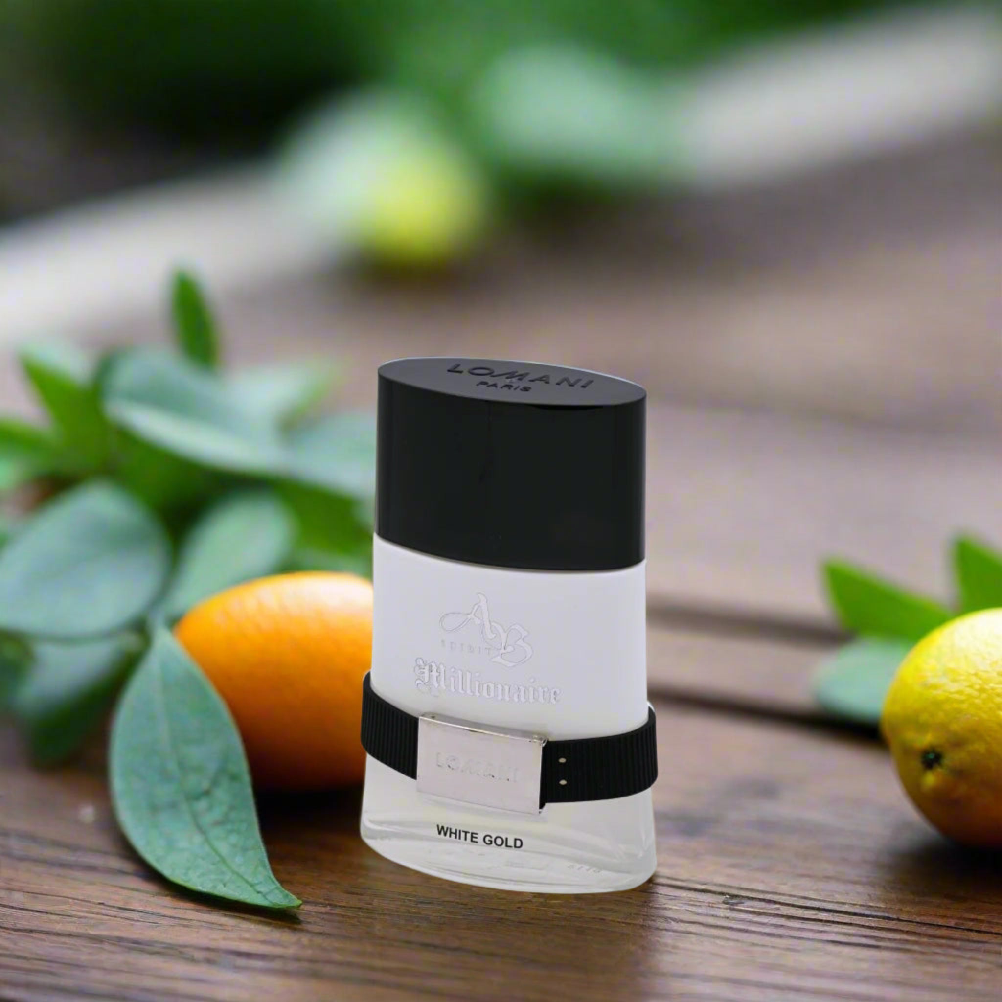 White and black cylindrical container with 'Lomani' branding on a wooden surface with fruits and leaves.