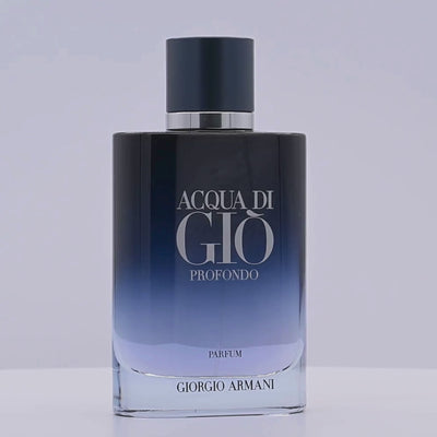 Acqua di Giò Profondo parfum bottle by Giorgio Armani rotating on a white podium