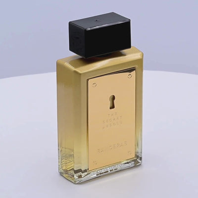 Banderas The Secret Absolu perfume bottle rotating on a white podium