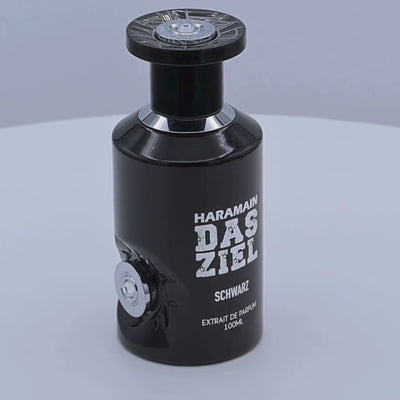 Haramain Das Ziel Schwarz perfume bottle rotating on a white podium