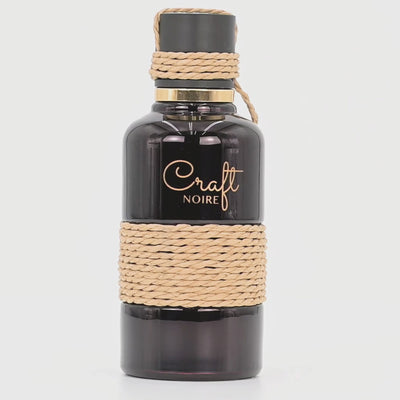 Craft Noire perfume bottle rotating on a white podium
