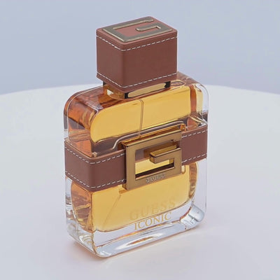 Guess Iconic perfume bottle rotating on a white podium