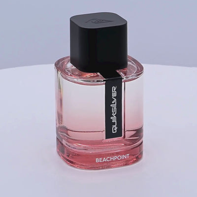 Quiksilver Beachpoint perfume bottle rotating on a white podium