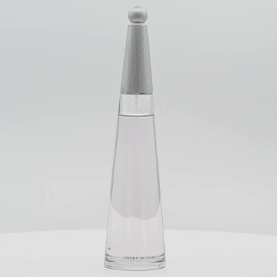 Issey Miyake L'Eau d'Issey perfume bottle rotating on a white podium
