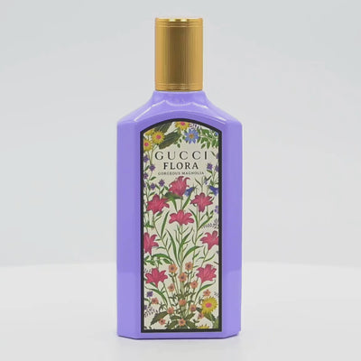 Gucci Flora Magnolia perfume bottle rotating on a white podium
