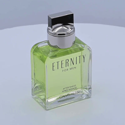 Calvin Klein Eternity for Men after shave bottle rotating on a white podium