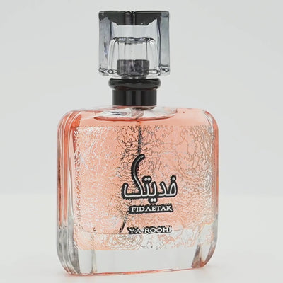 Fidae Tak perfume bottle rotating on a white podium