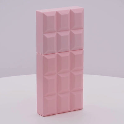 Pink perfume bottle with geometric pattern rotating on a white podium