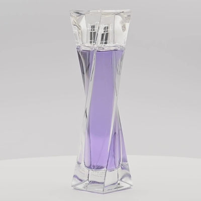 Lancème Hypnôse perfume bottle rotating on a white podium
