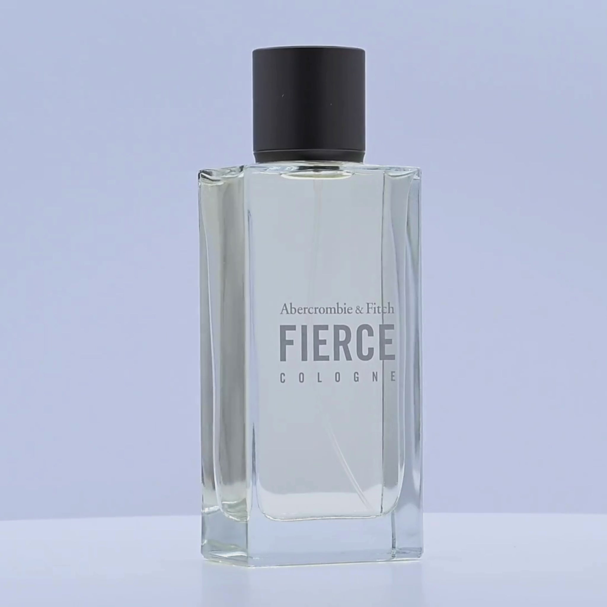 Abercrombie & Fitch Fierce cologne bottle rotating on a white podium