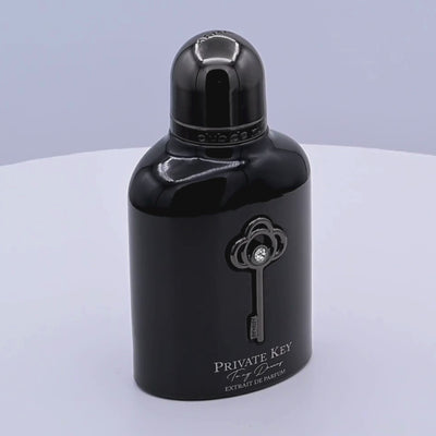 Black Armaf Private Key perfume bottle rotating on a white podium