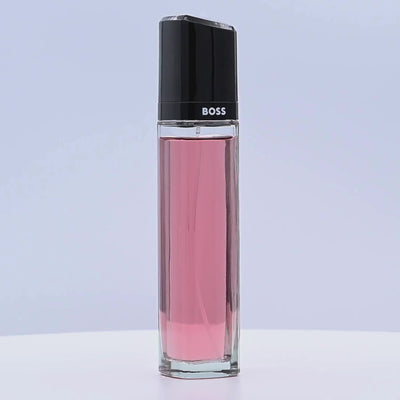 BOSS Ma Vie perfume bottle rotating on a white podium
