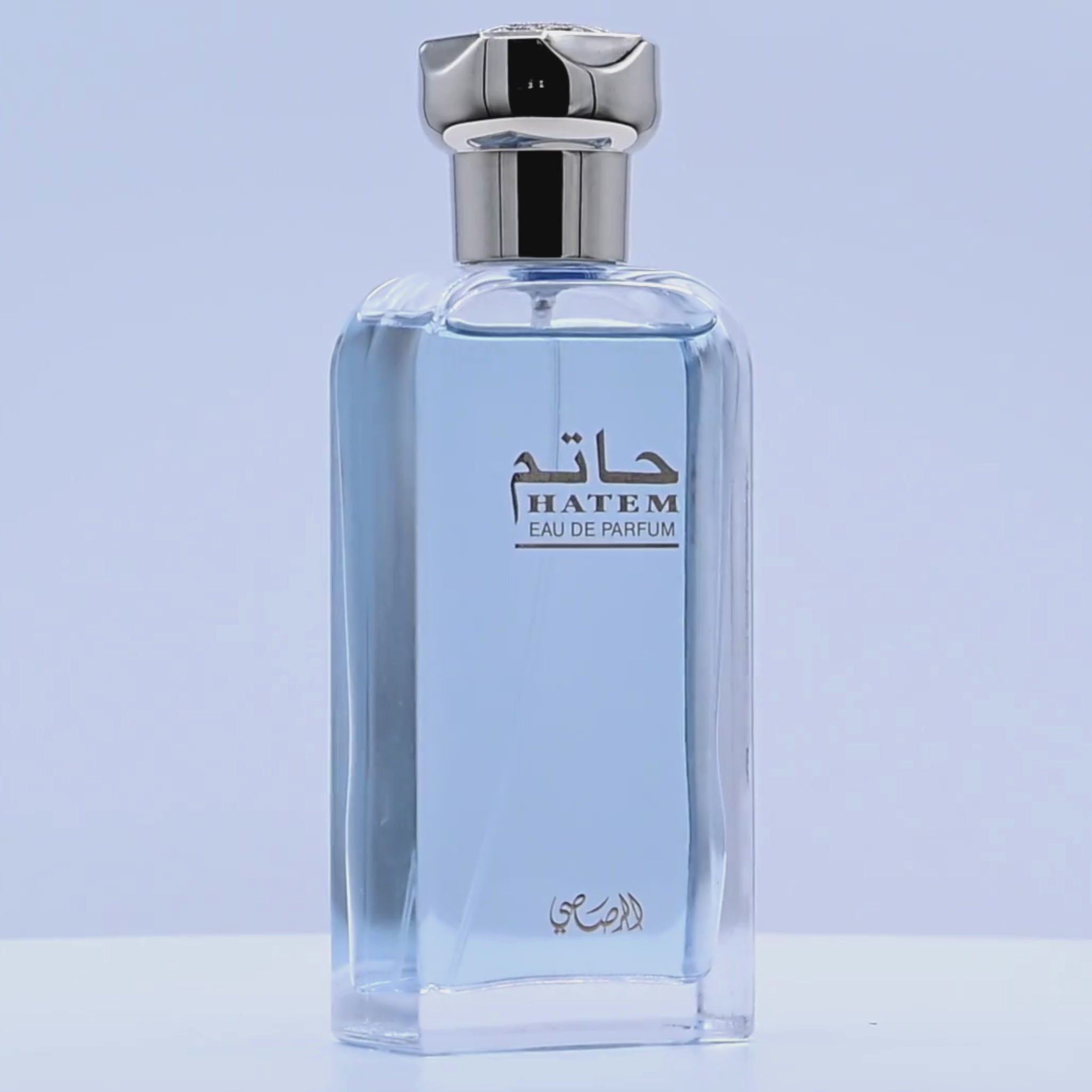Hatem Eau de Parfum bottle rotating on a white podium