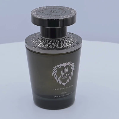 Al Haramain Azlan Oud perfume bottle rotating on a white podium