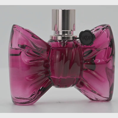 Bonbon by Viktor & Rolf  perfume bottle rotating on a white podium