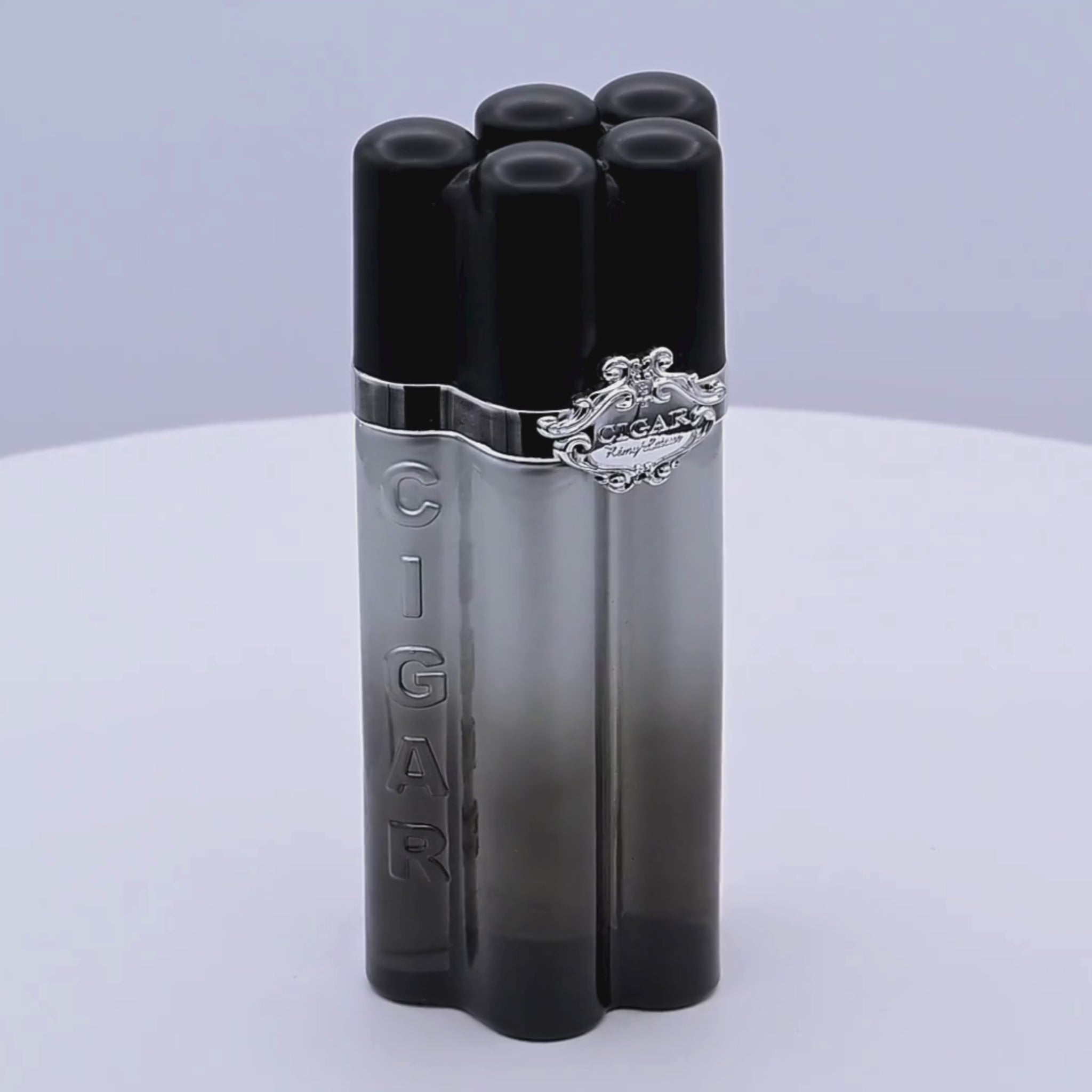 Cigar-themed perfume bottle rotating on a white podium