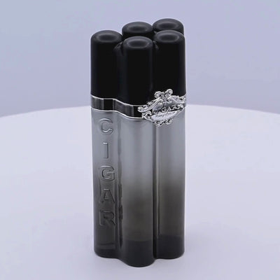 Cigar-themed perfume bottle rotating on a white podium