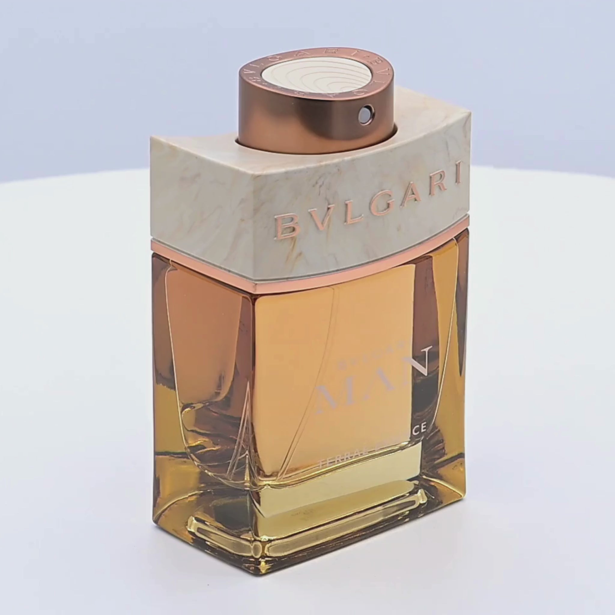 Bvlgari Eau de Parfum bottle rotating on a white podium