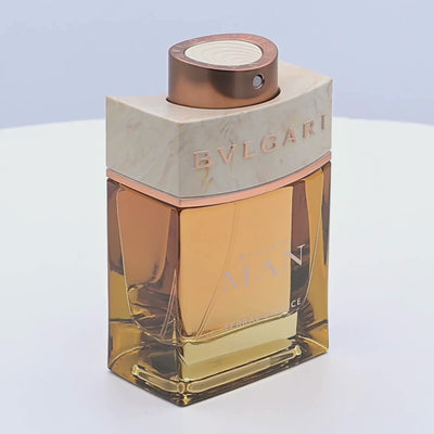 Bvlgari Eau de Parfum bottle rotating on a white podium