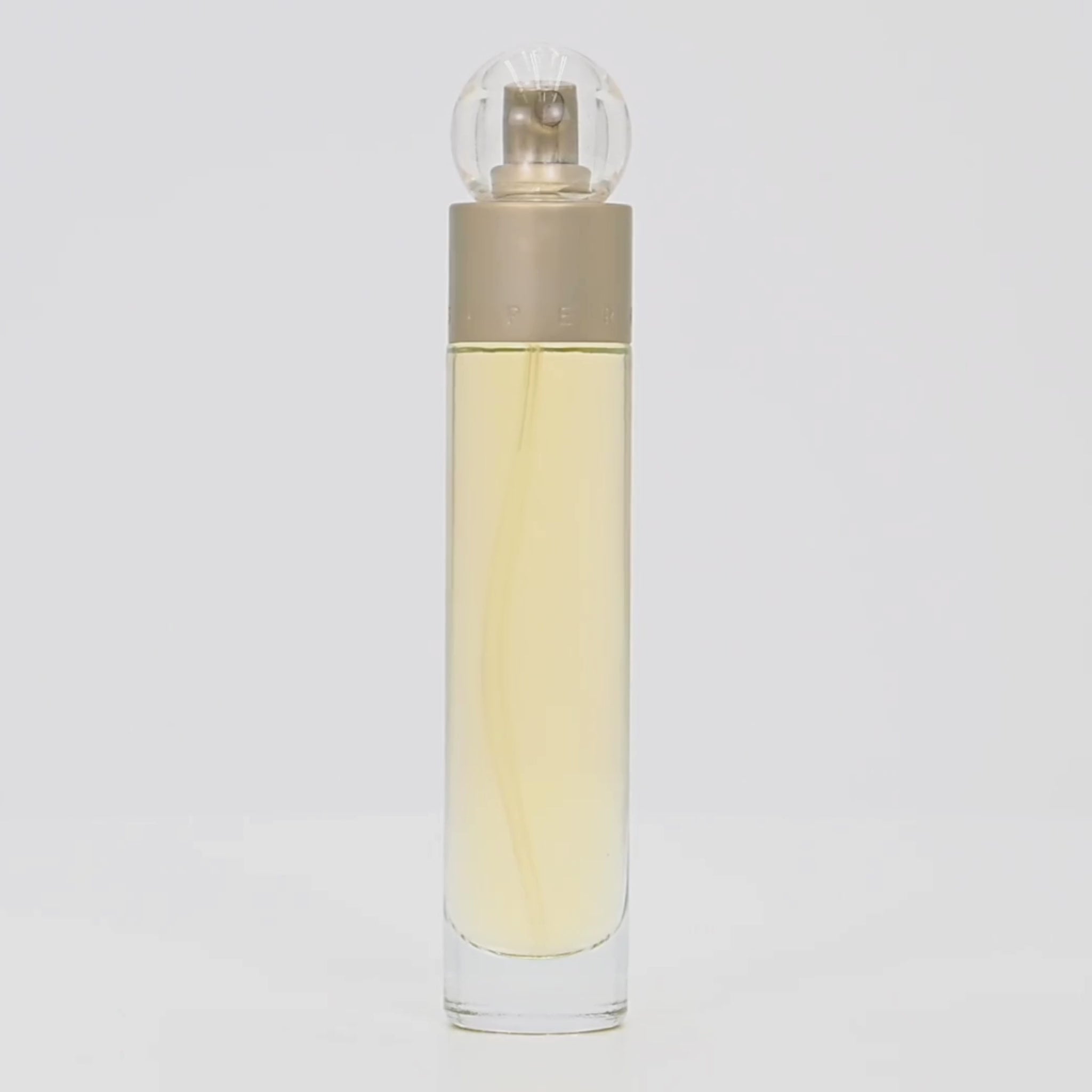 Perry Ellis 360° perfume bottle rotating on a white podium
