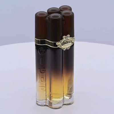 Cigar-shaped perfume bottles rotating on a white podium