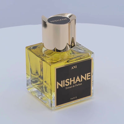 Nishane perfume bottle rotating on a white podium
