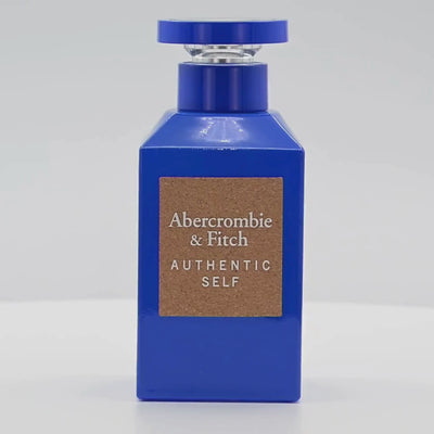 Abercrombie & Fitch perfume bottle rotating on a white podium
