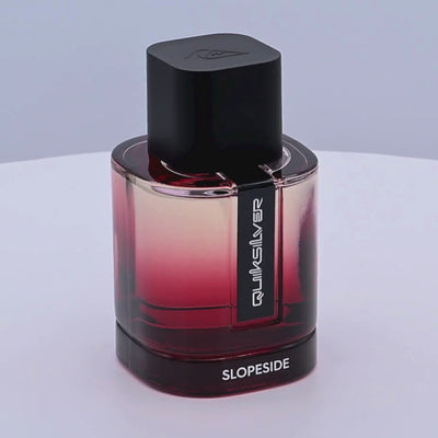 Quiksilver Slopeside perfume bottle with gradient design rotating on a white podium