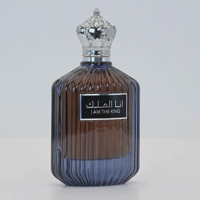 Ana Al Malik perfume bottle rotating on a white podium
