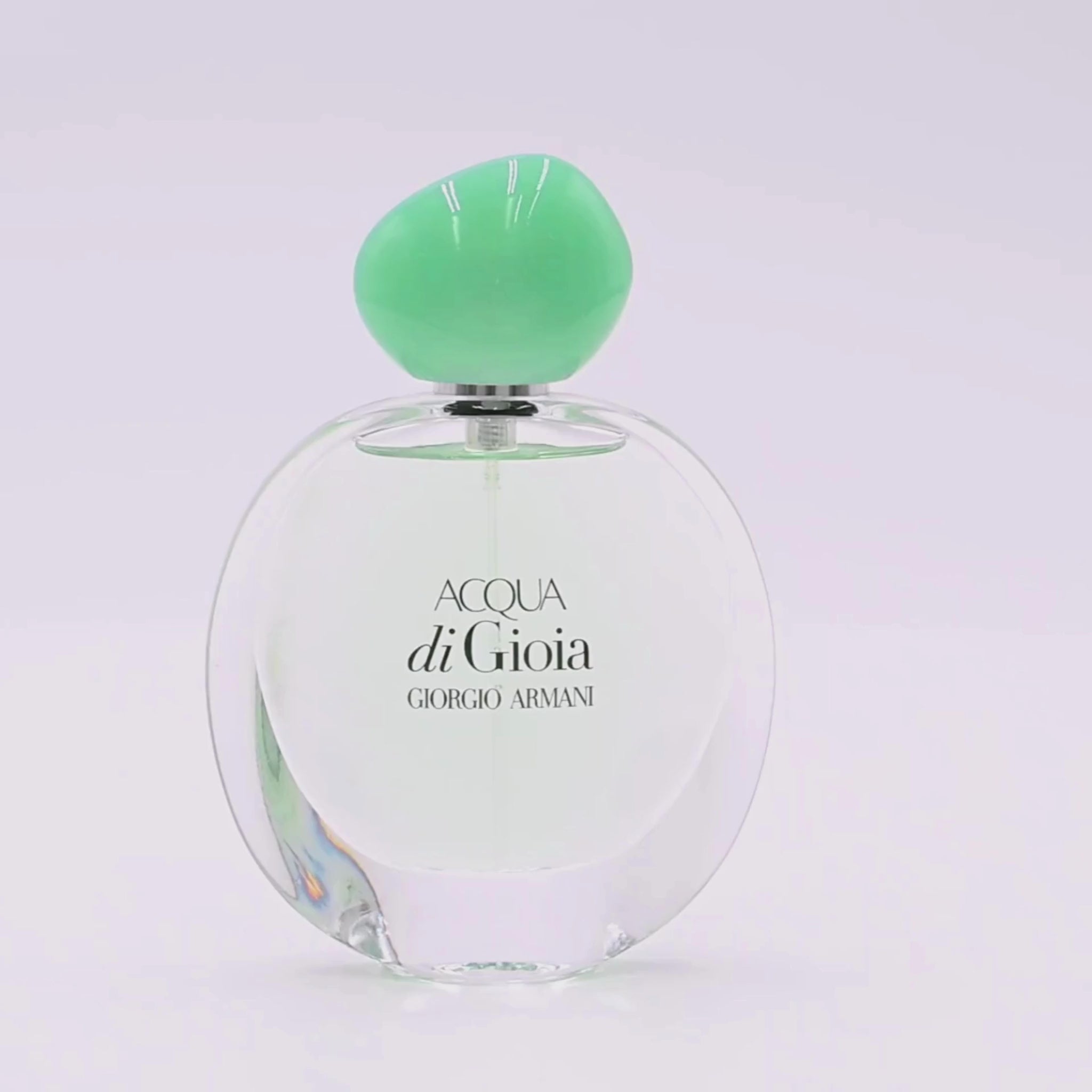 Giorgio Armani Acqua di Gioia perfume bottle rotating on a white podium
