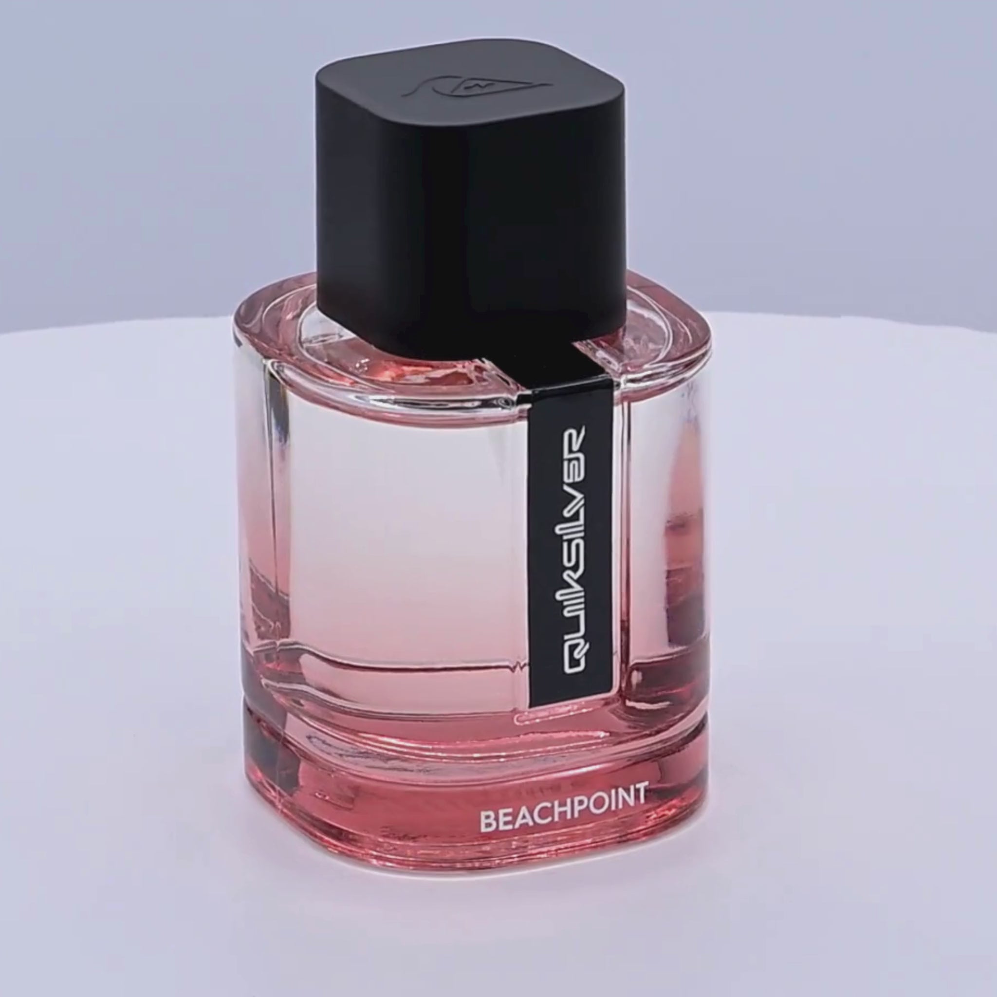 Quiksilver Beachpoint perfume bottle rotating a white podium