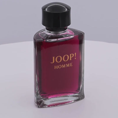 Joop! Homme perfume bottle rotating on a white podium