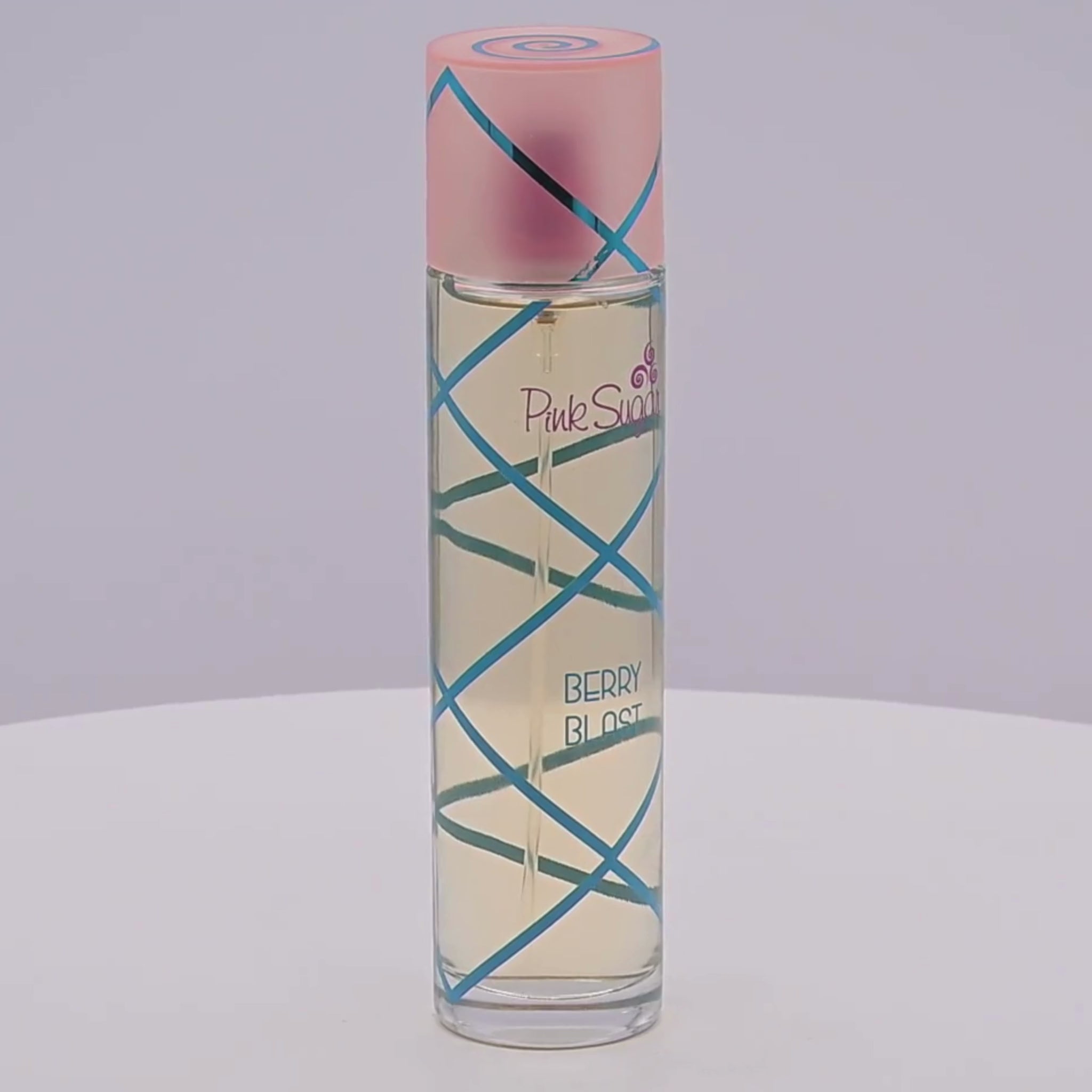 Perfume bottle labeled 'Pink Sugar Berry Blast' rotating on a white podium