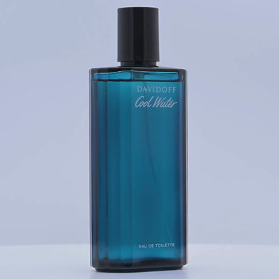 Blue Davidoff Cool Water eau de toilette bottle rotating on a white podium