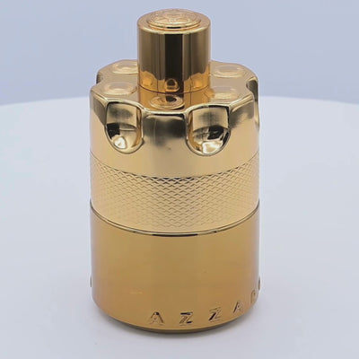 Gold Azzaro perfume bottle rotating on a white podium