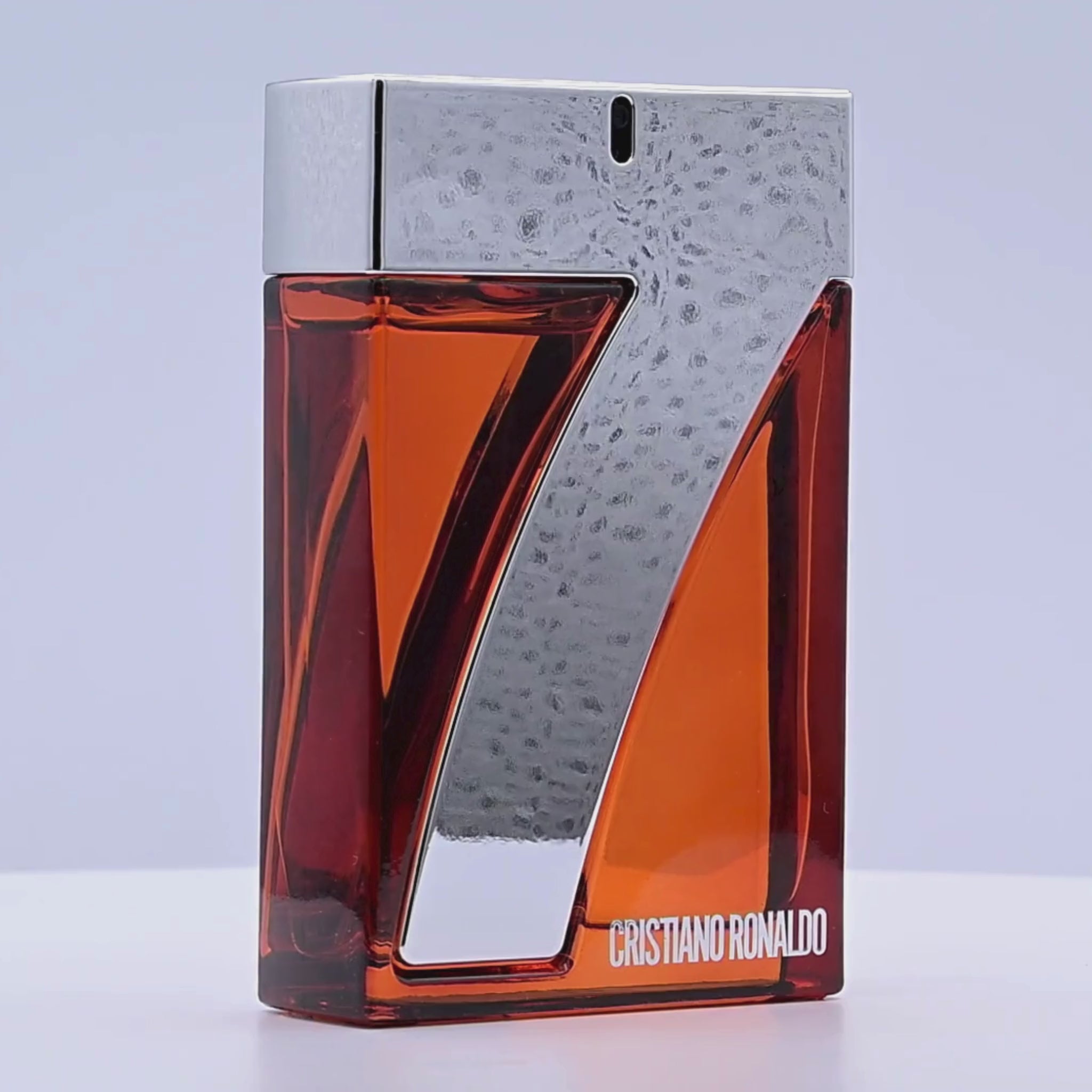 Cristiano Ronaldo perfume bottle rotating on a white podium
