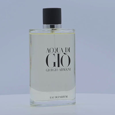 Acqua di Giò Giorgio Armani Eau de Parfum bottle rotating on a white podium