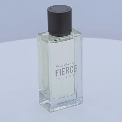 Abercrombie & Fitch Fierce cologne bottle rotating on a white podium
