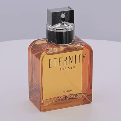 Calvin Klein Eternity for Men parfum bottle rotating on a white podium
